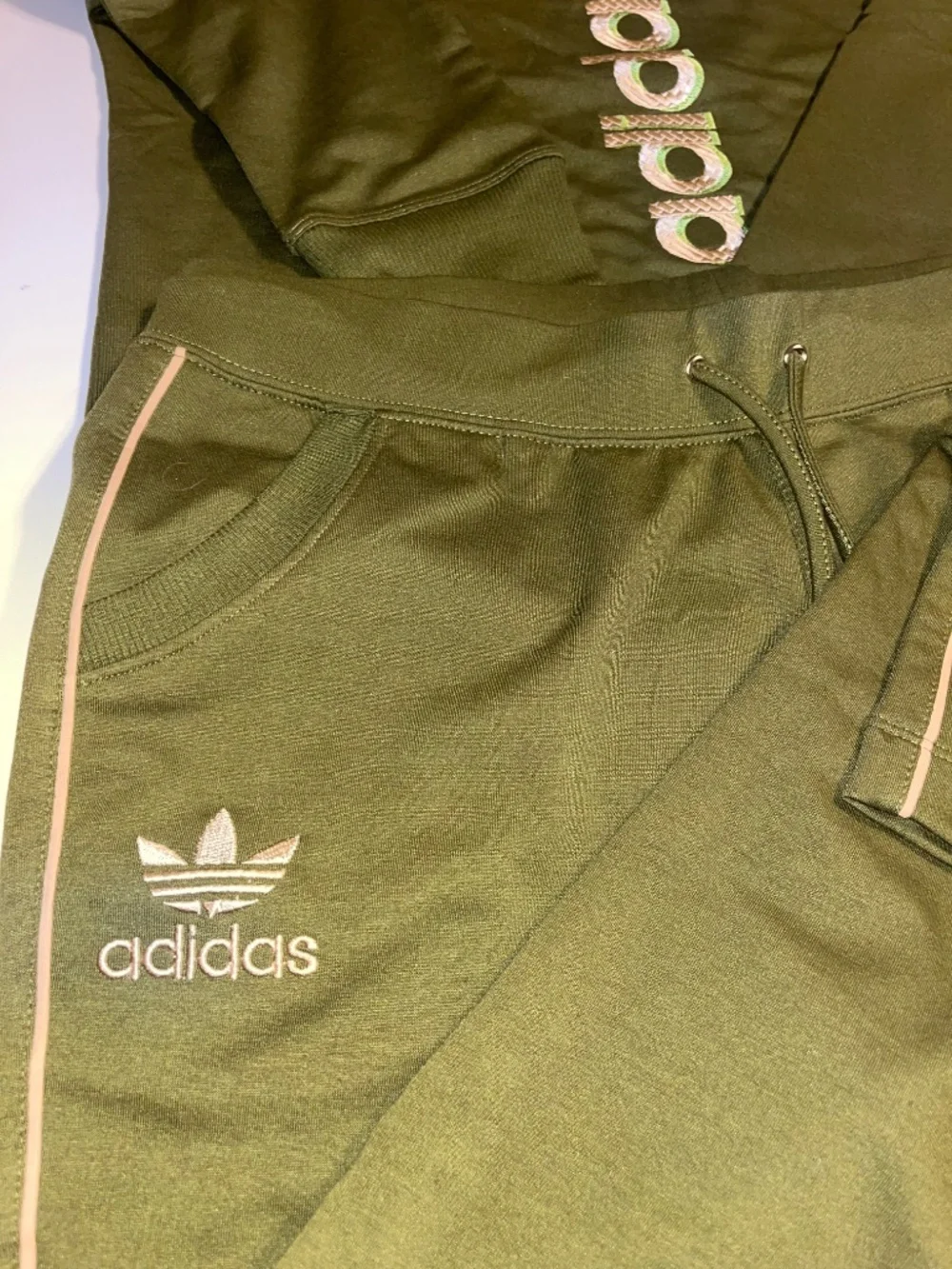 olive green Adidas matching sweatshirt and jogger set